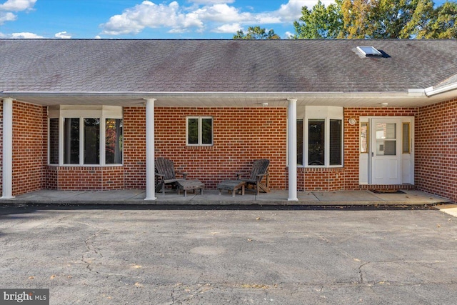 back of property with a patio