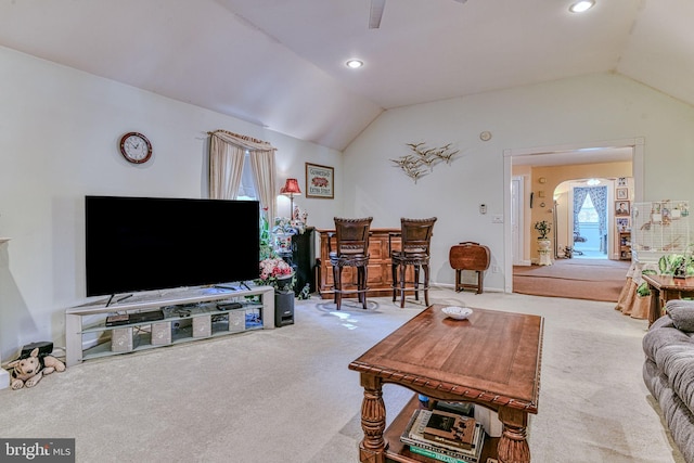 living room with lofted ceiling and carpet floors