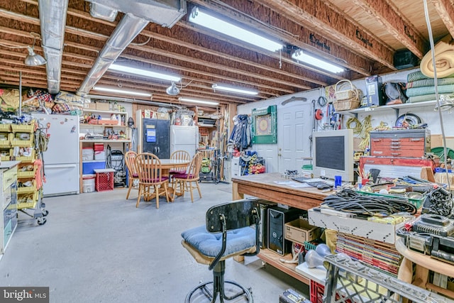 basement featuring white fridge