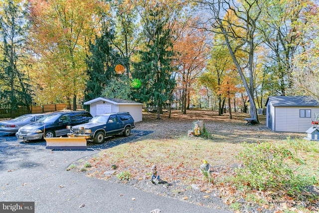 view of front of house featuring a storage unit