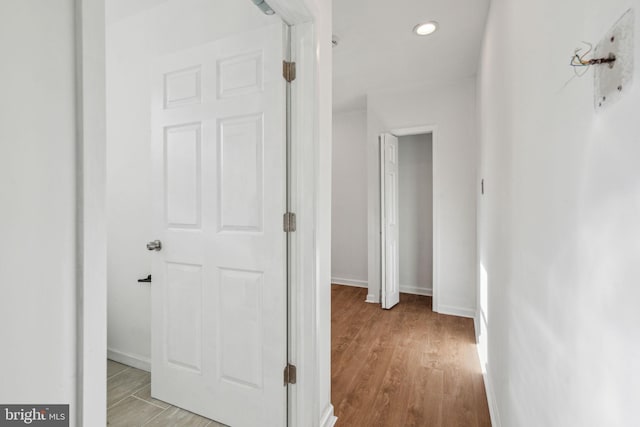 corridor featuring light hardwood / wood-style floors