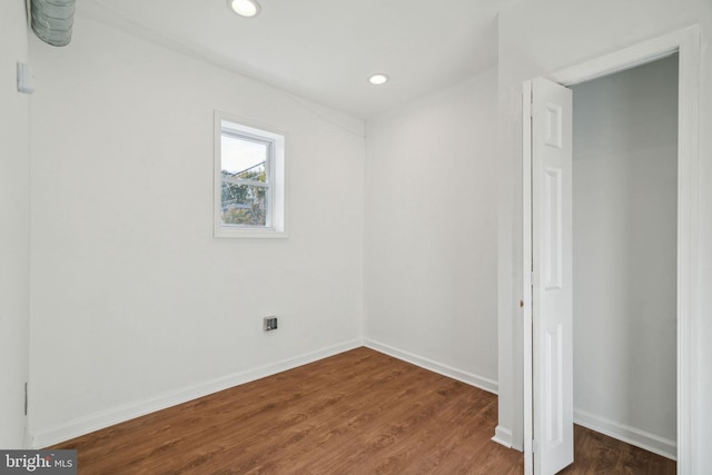 unfurnished bedroom featuring dark wood-type flooring