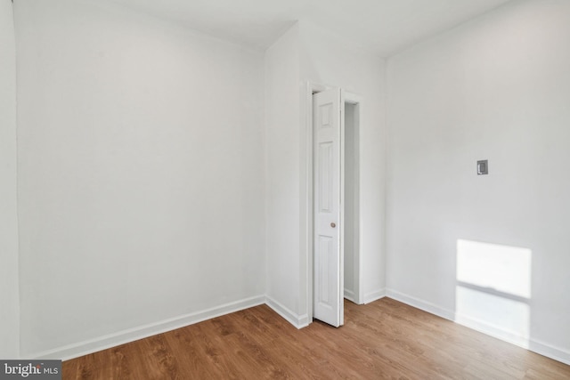 spare room featuring light hardwood / wood-style floors