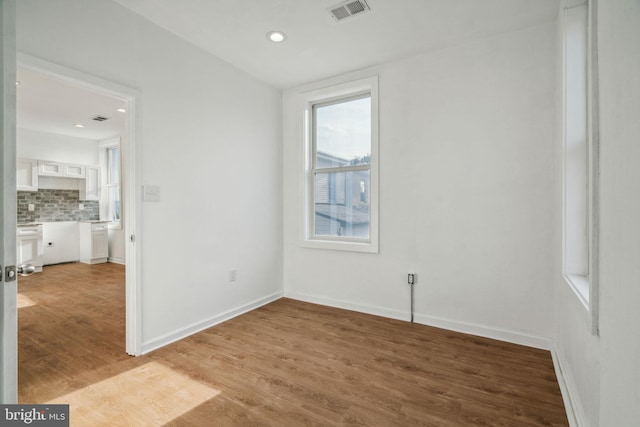 spare room featuring light wood-type flooring