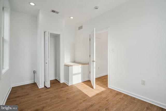 unfurnished bedroom with wood-type flooring