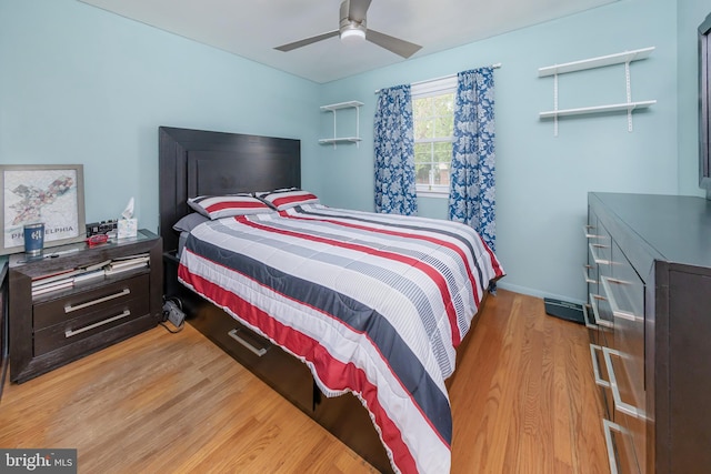 bedroom featuring light wood-type flooring and ceiling fan