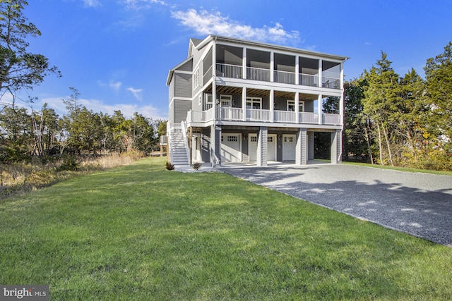 view of front facade with a front yard and a garage