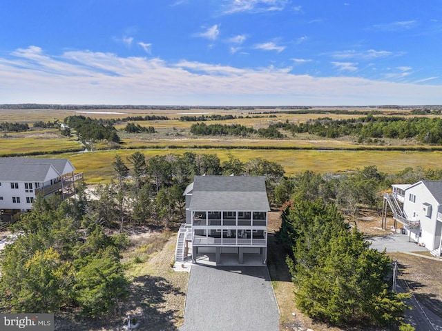 birds eye view of property with a rural view