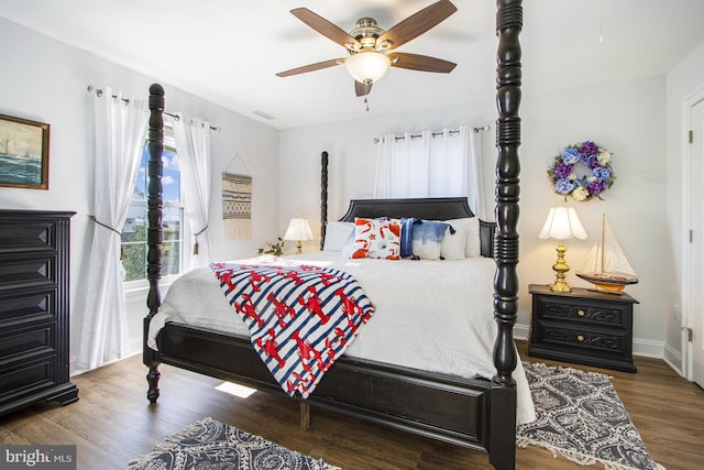 bedroom featuring hardwood / wood-style floors and ceiling fan