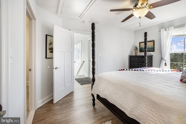 bedroom with wood-type flooring and ceiling fan