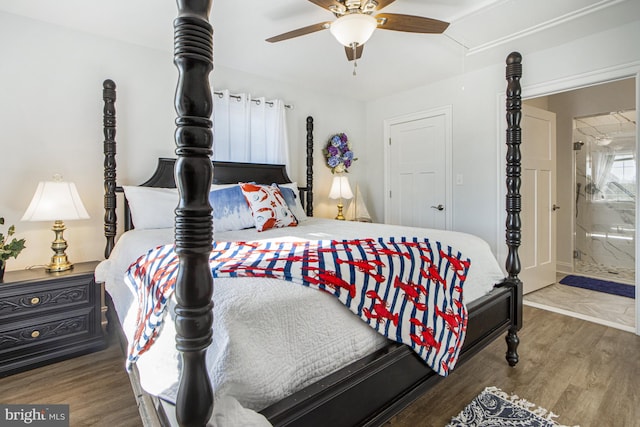 bedroom with ensuite bath, hardwood / wood-style floors, and ceiling fan