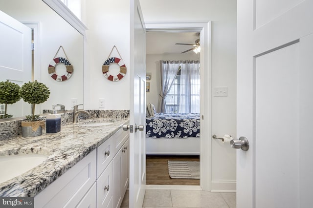 bathroom with vanity, ceiling fan, and tile patterned flooring