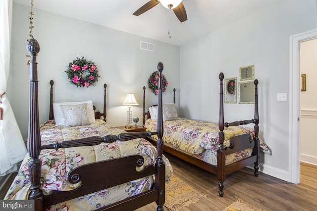 bedroom featuring wood-type flooring and ceiling fan