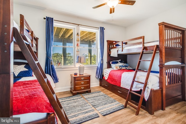 bedroom with wood-type flooring and ceiling fan