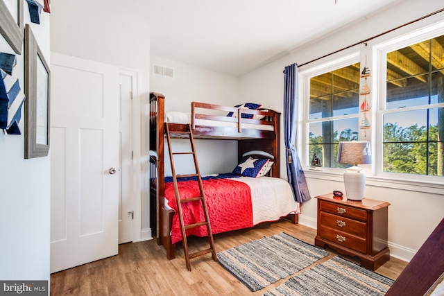 bedroom with wood-type flooring