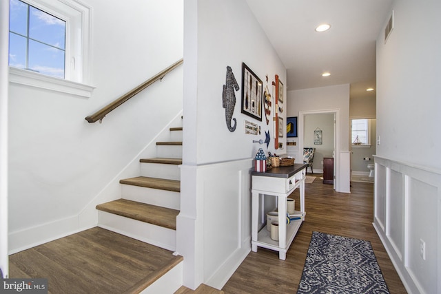 stairway featuring wood-type flooring