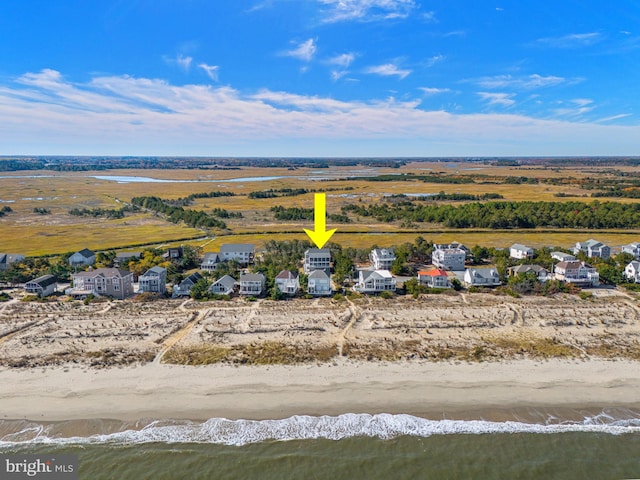 drone / aerial view with a view of the beach and a water view