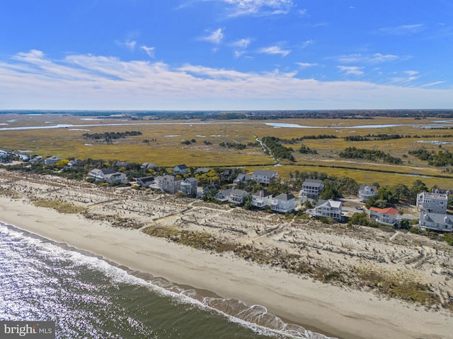 birds eye view of property featuring a view of the beach and a water view