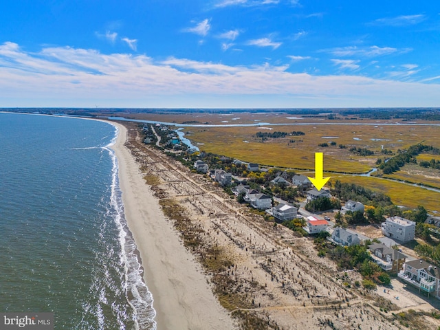 birds eye view of property featuring a water view and a view of the beach