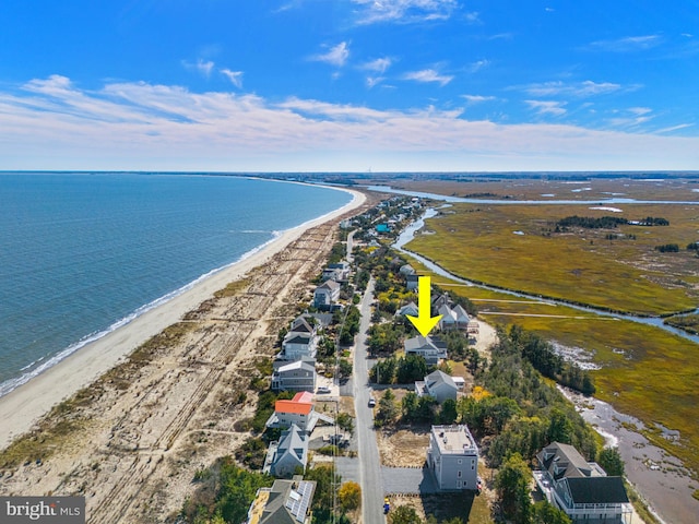 aerial view featuring a water view and a beach view