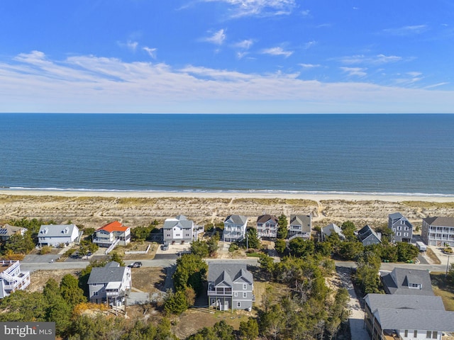 aerial view with a water view and a view of the beach