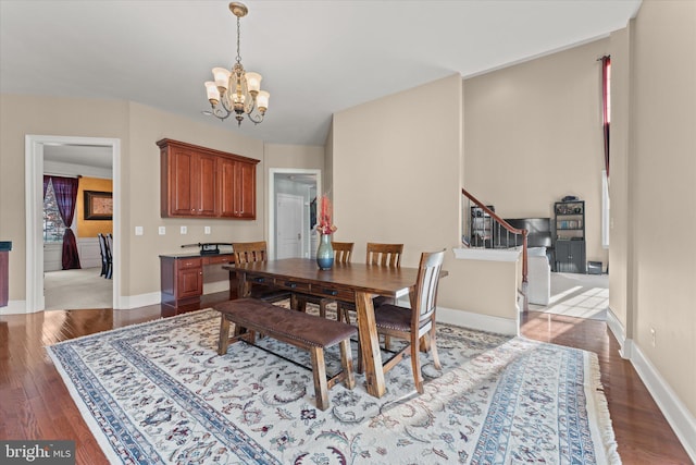 20069 Forest Farm Ln, Ashburn, VA 20147 - dining space featuring baseboards, stairway, an inviting chandelier, and wood finished floors