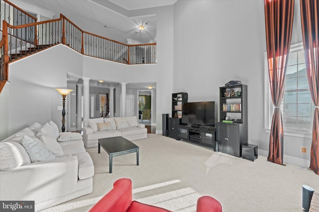 20069 Forest Farm Ln, Ashburn, VA 20147 - living room featuring decorative columns, stairway, carpet flooring, a high ceiling, and baseboards