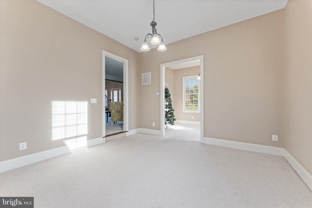20069 Forest Farm Ln, Ashburn, VA 20147 - spare room featuring visible vents, light carpet, baseboards, and a notable chandelier