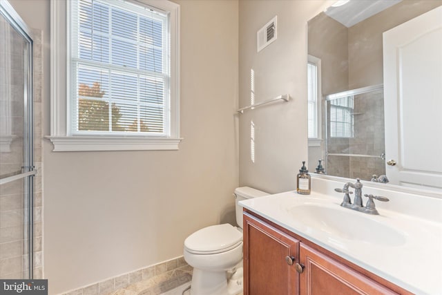 20069 Forest Farm Ln, Ashburn, VA 20147 - bathroom with toilet, vanity, visible vents, baseboards, and tiled shower
