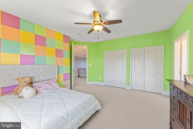 20069 Forest Farm Ln, Ashburn, VA 20147 - bedroom with a ceiling fan, baseboards, visible vents, light carpet, and multiple closets