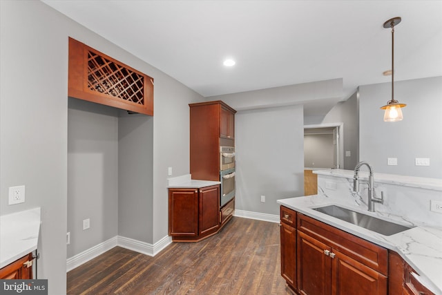 20069 Forest Farm Ln, Ashburn, VA 20147 - kitchen featuring a sink, stainless steel double oven, pendant lighting, baseboards, and dark wood-style floors