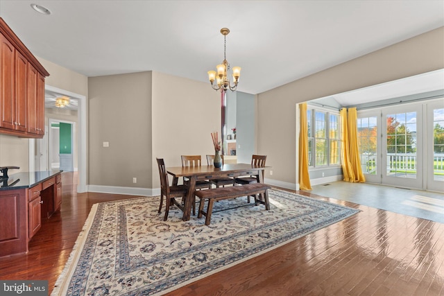 20069 Forest Farm Ln, Ashburn, VA 20147 - dining space featuring dark wood-style flooring, a notable chandelier, and baseboards