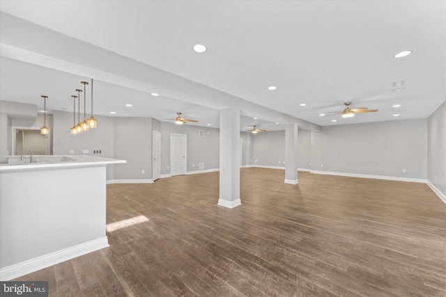 20069 Forest Farm Ln, Ashburn, VA 20147 - unfurnished living room with recessed lighting, baseboards, a ceiling fan, and wood finished floors