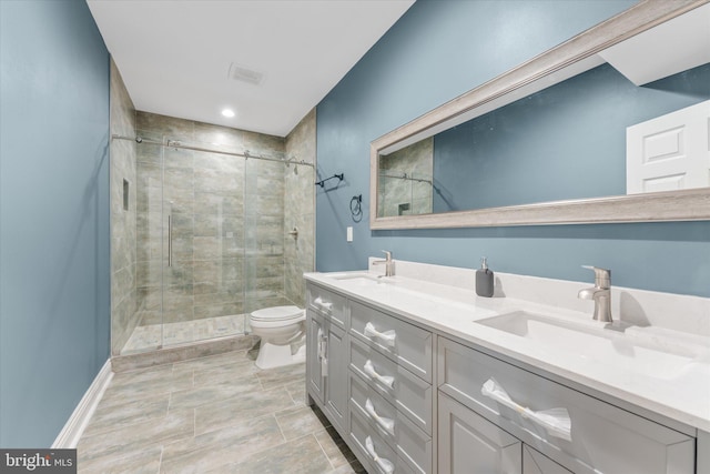20069 Forest Farm Ln, Ashburn, VA 20147 - bathroom featuring double vanity, toilet, a stall shower, and a sink