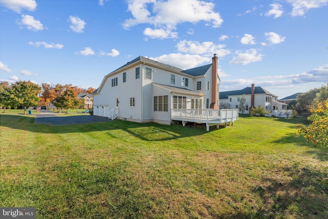 20069 Forest Farm Ln, Ashburn, VA 20147 - back of property with a lawn, a chimney, and a deck