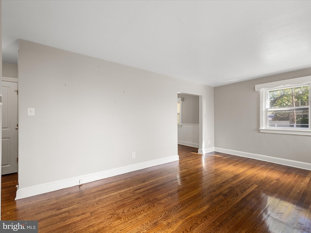 spare room featuring dark hardwood / wood-style flooring