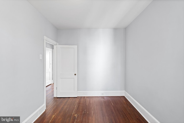 unfurnished room featuring dark hardwood / wood-style floors