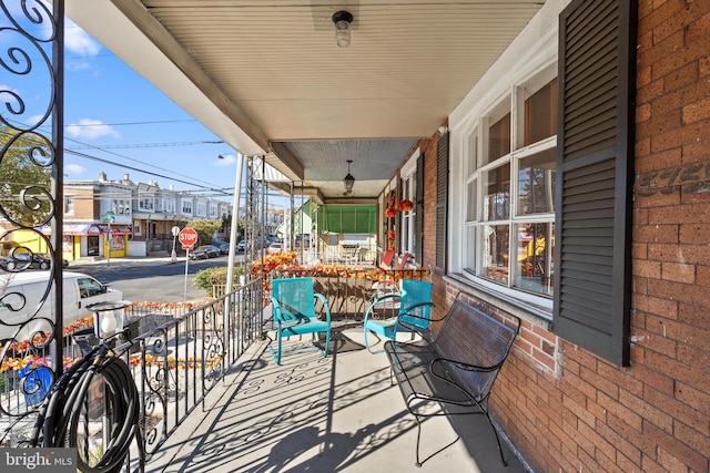 balcony featuring a porch