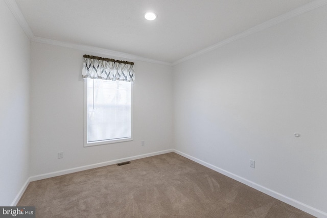 carpeted empty room with crown molding