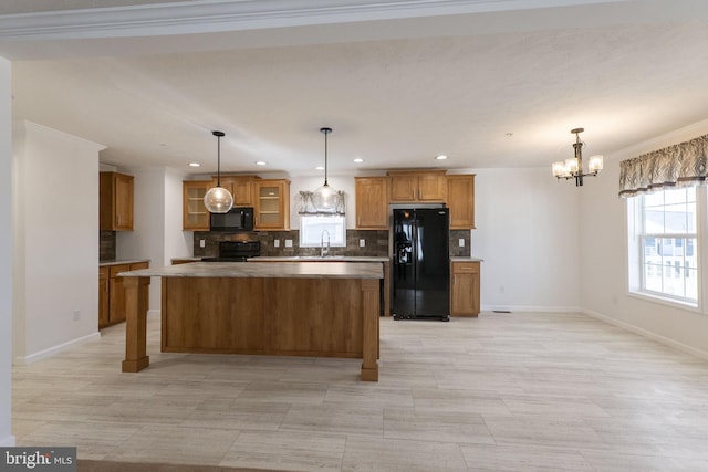 1362 Connecticut Ave, Hagerstown, MD 21740 - kitchen featuring black appliances, a sink, brown cabinets, a chandelier, and recessed lighting