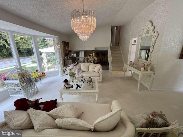 living room with light carpet, a notable chandelier, and a textured ceiling