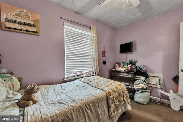 carpeted bedroom with ceiling fan