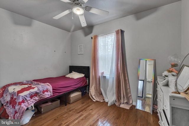 bedroom featuring hardwood / wood-style flooring and ceiling fan