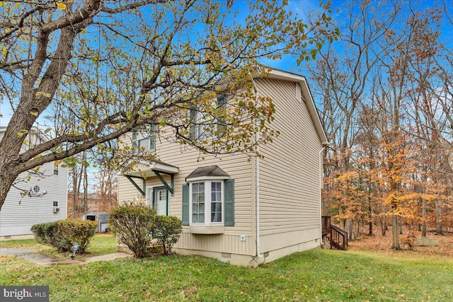 view of home's exterior featuring a yard