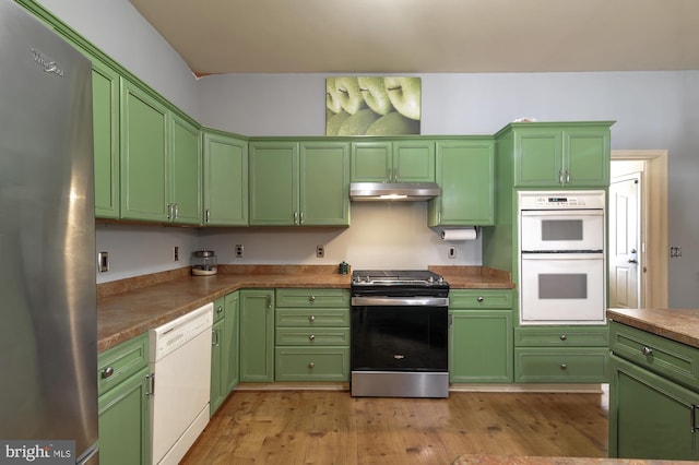 kitchen with light hardwood / wood-style floors, stainless steel appliances, and green cabinetry