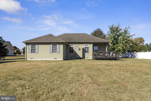 view of front of property with a wooden deck and a front lawn