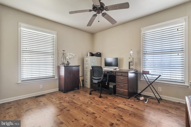 office area with hardwood / wood-style floors, a healthy amount of sunlight, and ceiling fan