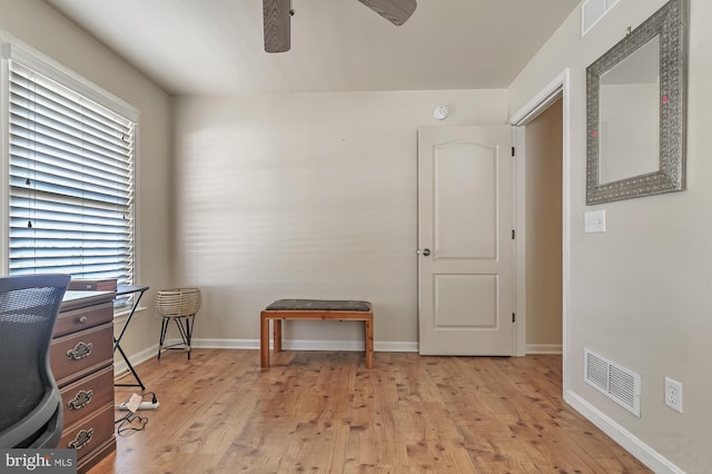 office area with light hardwood / wood-style floors and ceiling fan