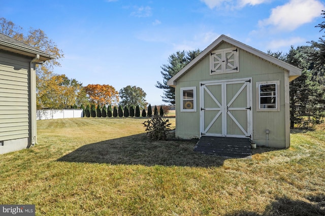 view of outdoor structure featuring a yard