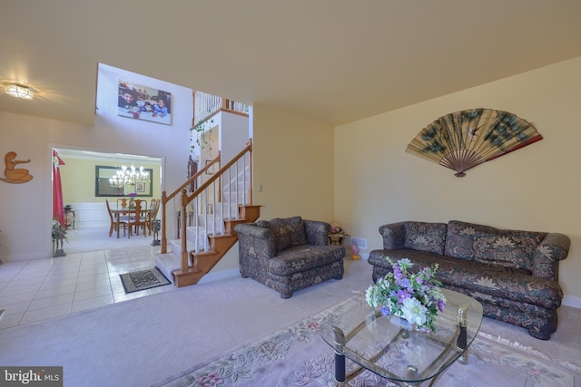 living room featuring a chandelier and tile patterned flooring